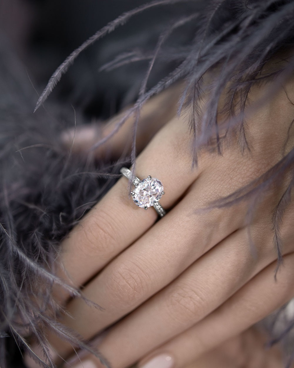 Ring with a stone in an oval cut