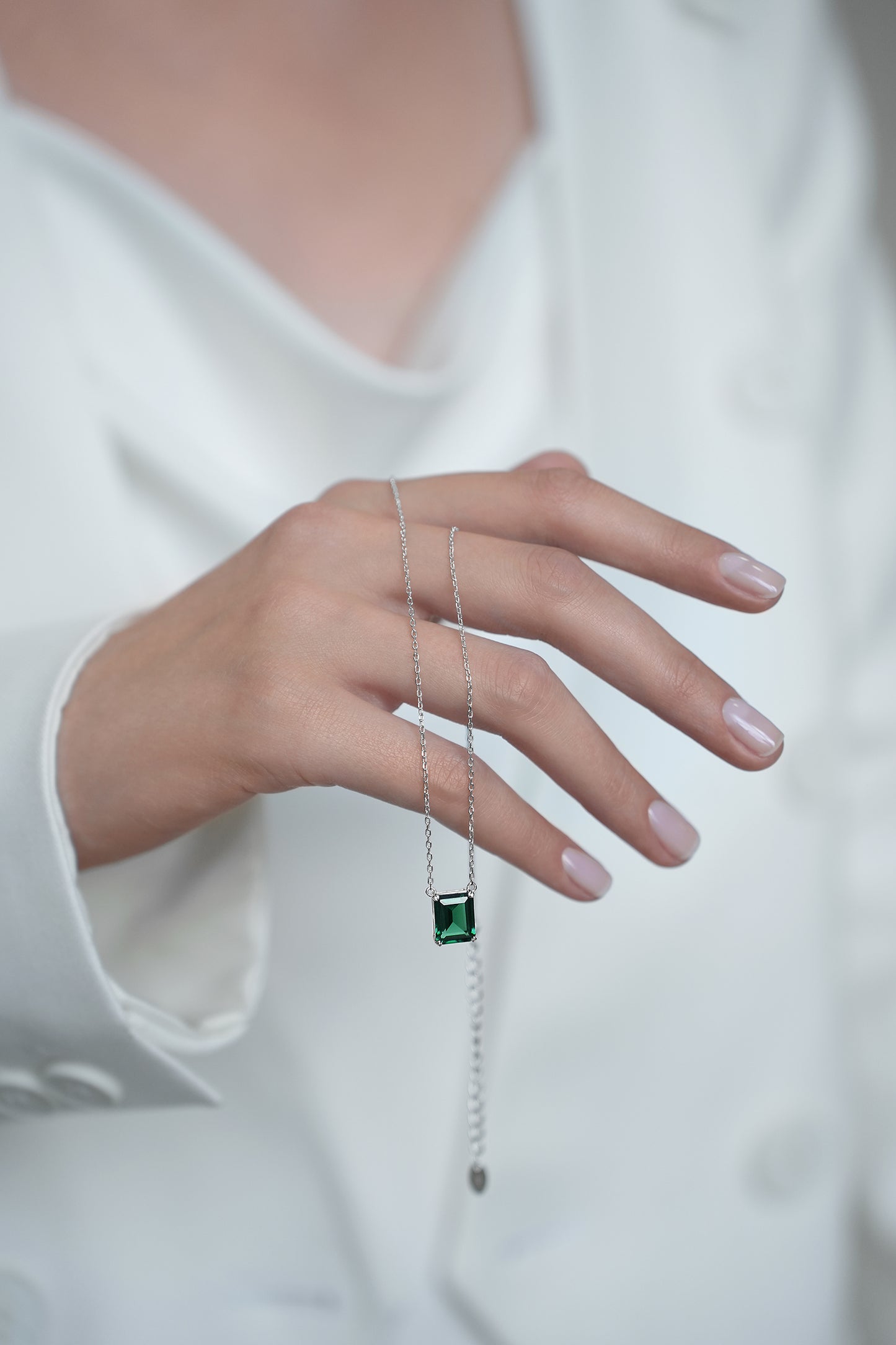 Necklace with green stone in baguette cut