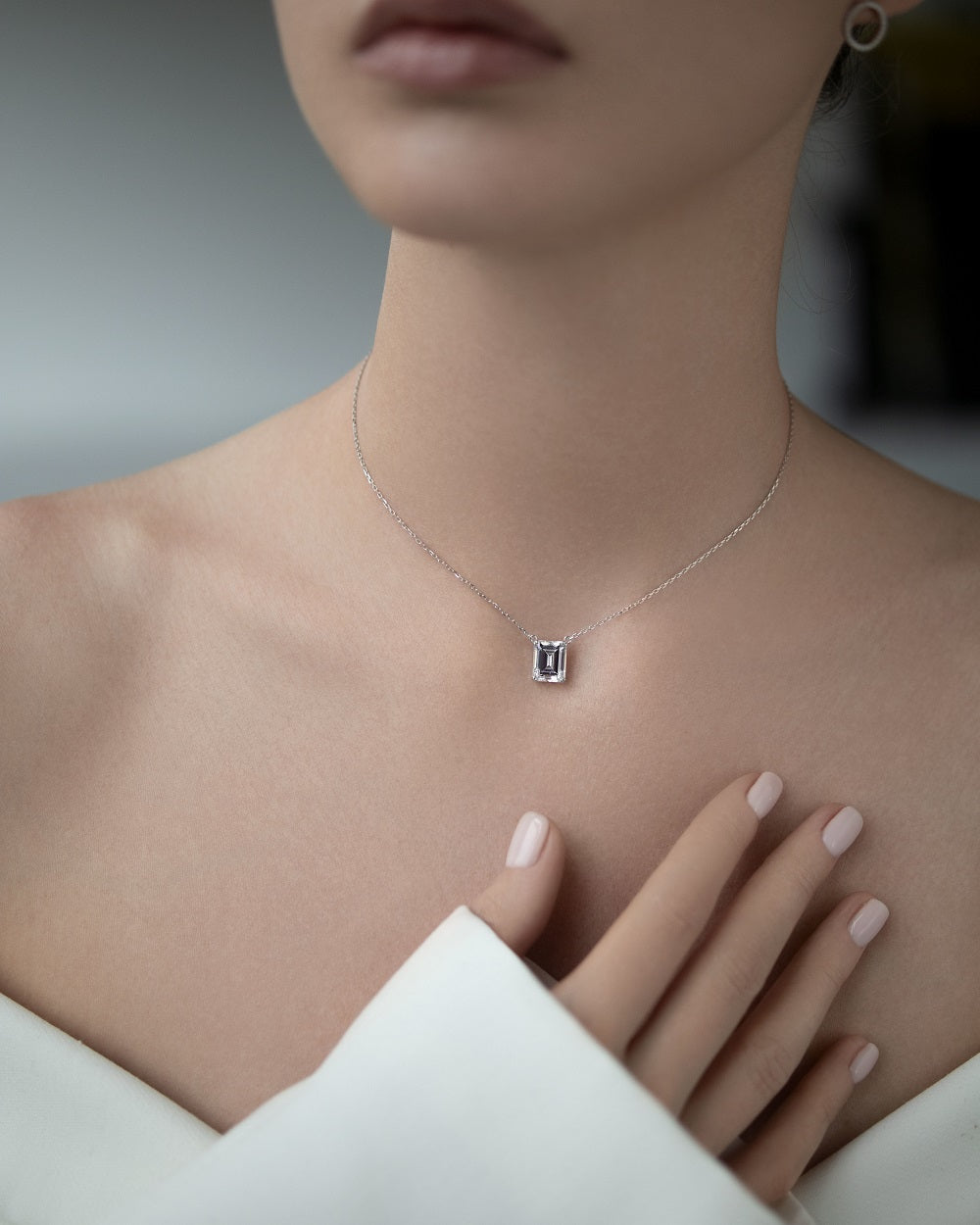 Necklace with a stone in a baguette cut