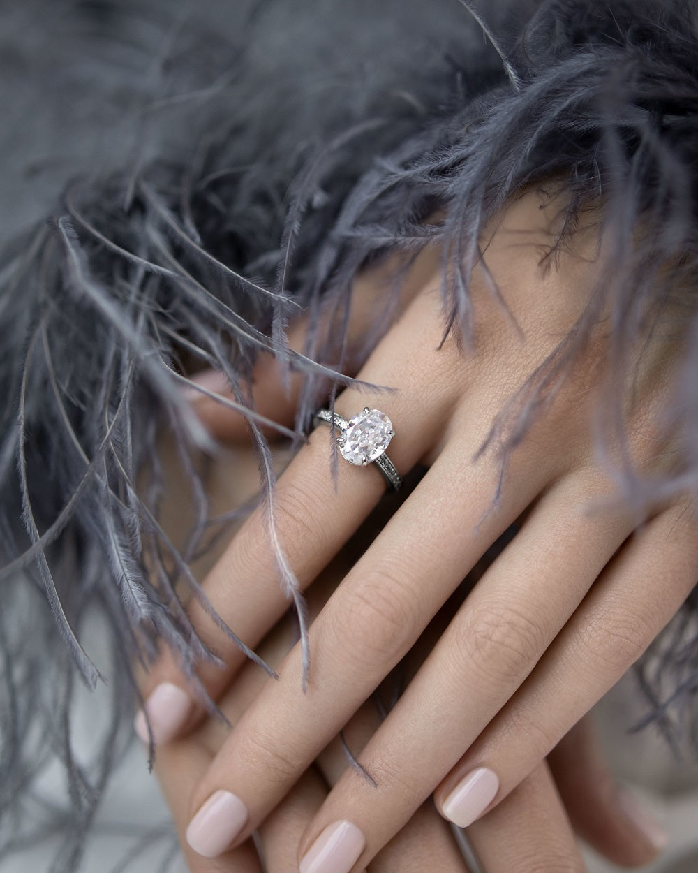 Ring with a stone in an oval cut