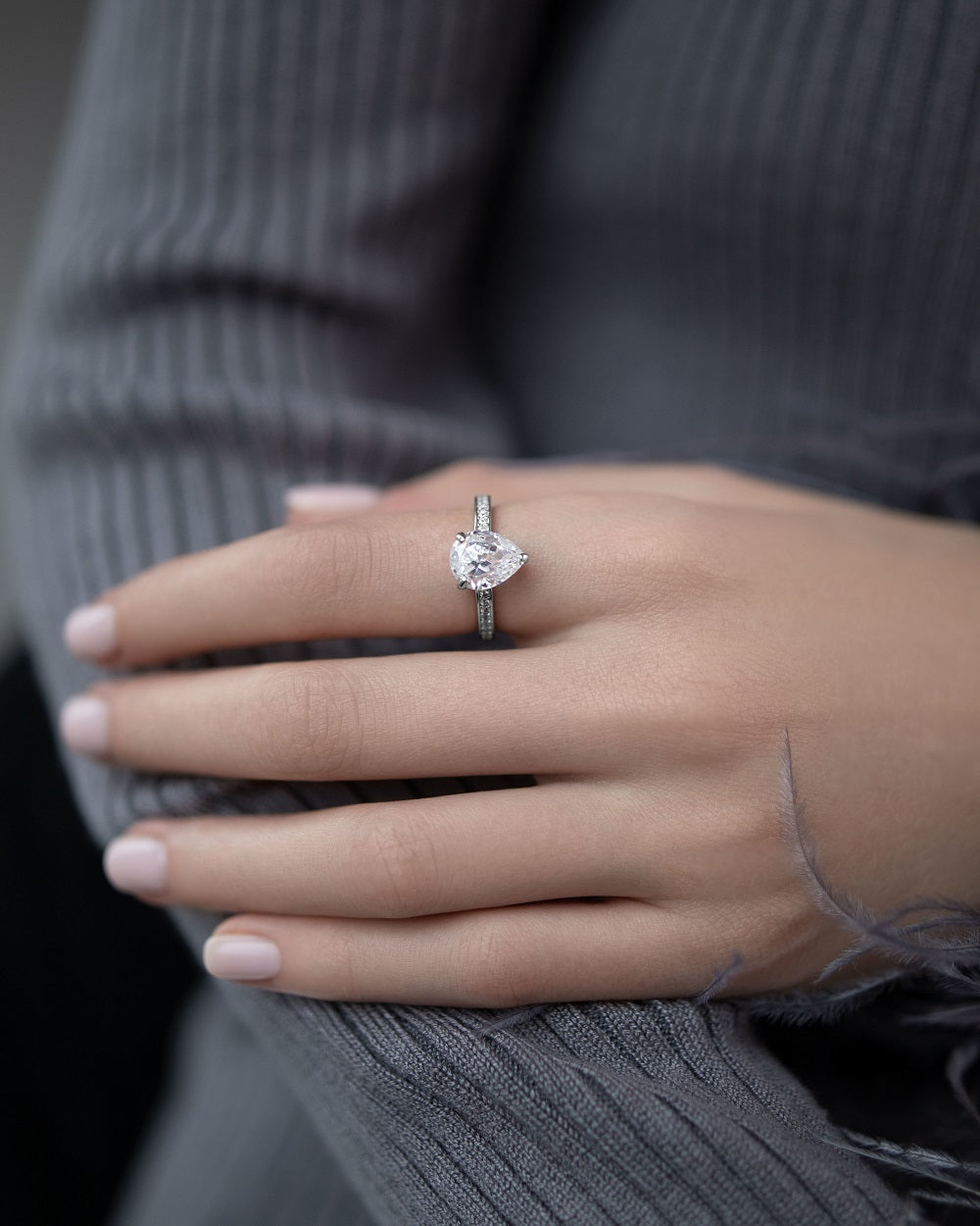 Ring with a stone in a pear cut