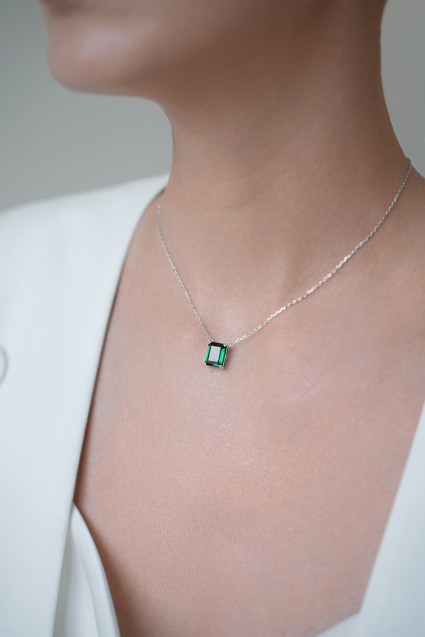 Necklace with green stone in baguette cut