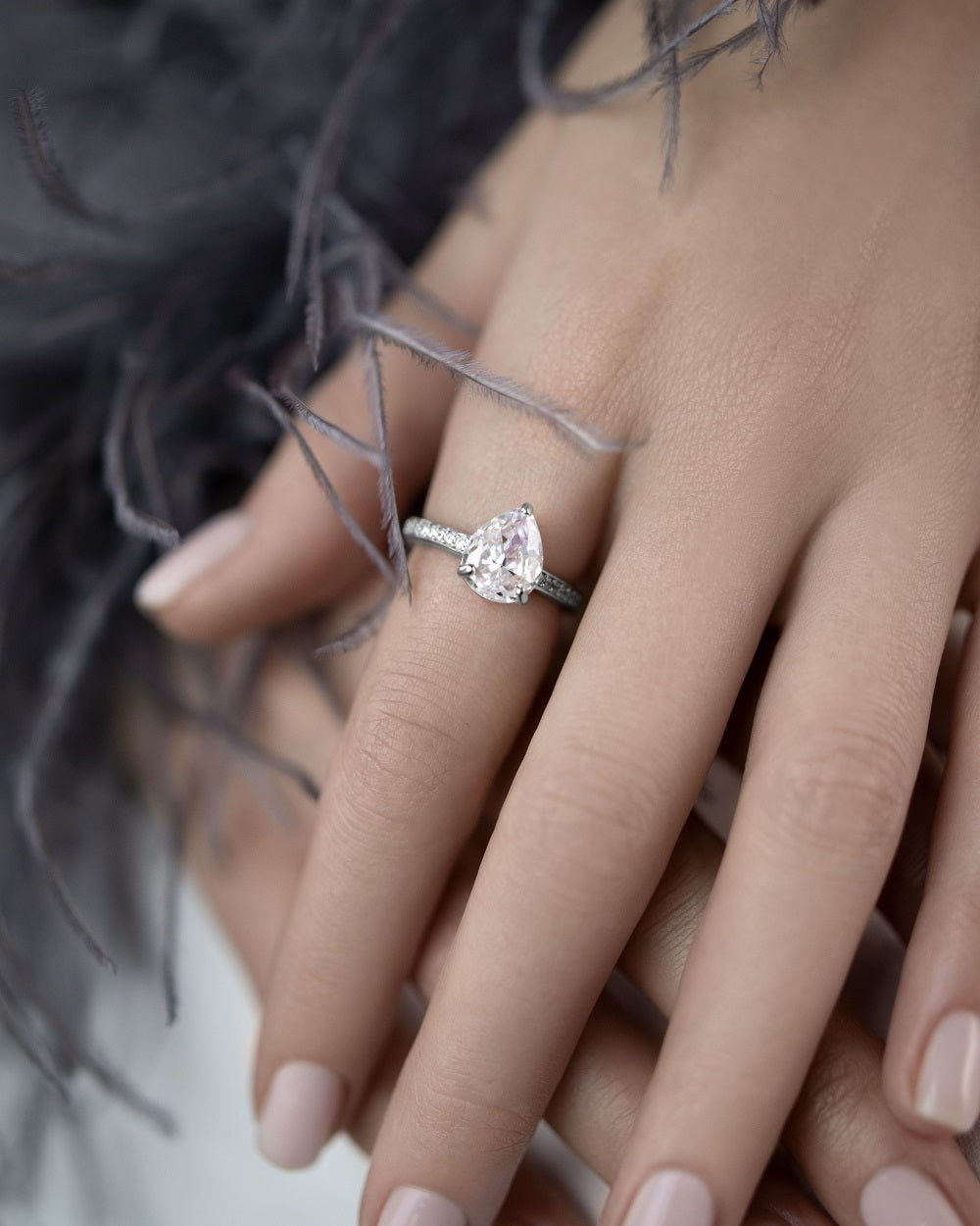 Ring with a stone in a pear cut