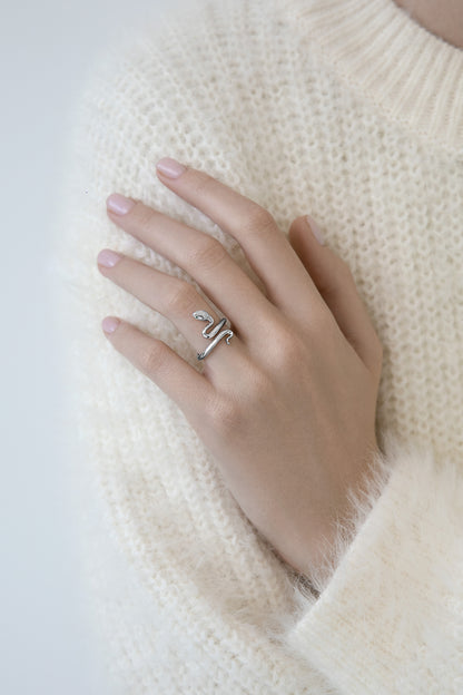 Snake ring with green stones