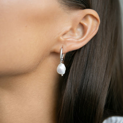 Earrings with Baroque pearls on an English lock