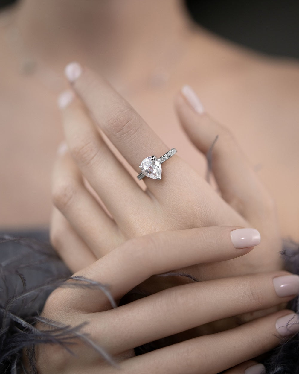 Ring with a stone in a pear cut