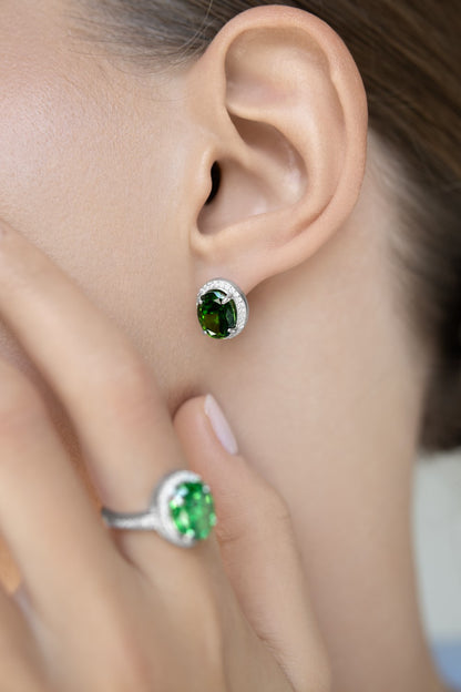 Earrings with emerald stones